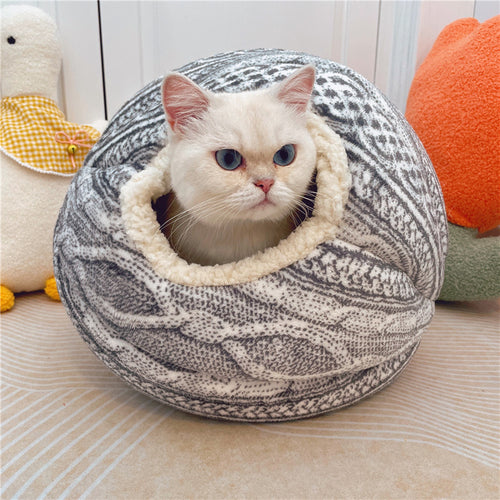 Toca Cozy Nest hand-woven wool cat bed in natural wool